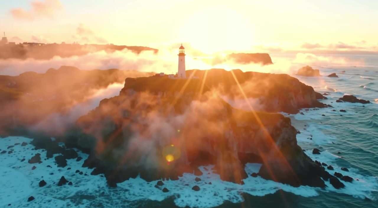 Input still of a lighthouse on a cliff at dawn