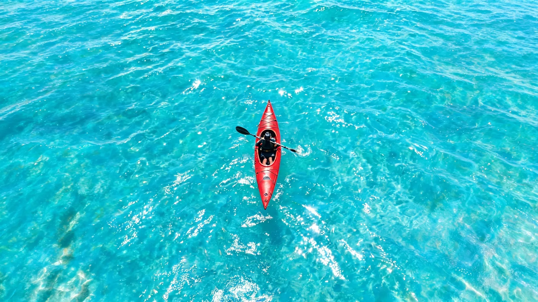 Kayak aerial extended with Pixazo AI into a wide banner of open turquoise sea.