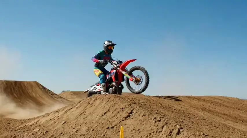 A motocross rider on a dirt track — frame from Pixazo image-to-video output
